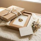Nose print frame in tissue paper inside a kraft gift box with a card and dried flowers